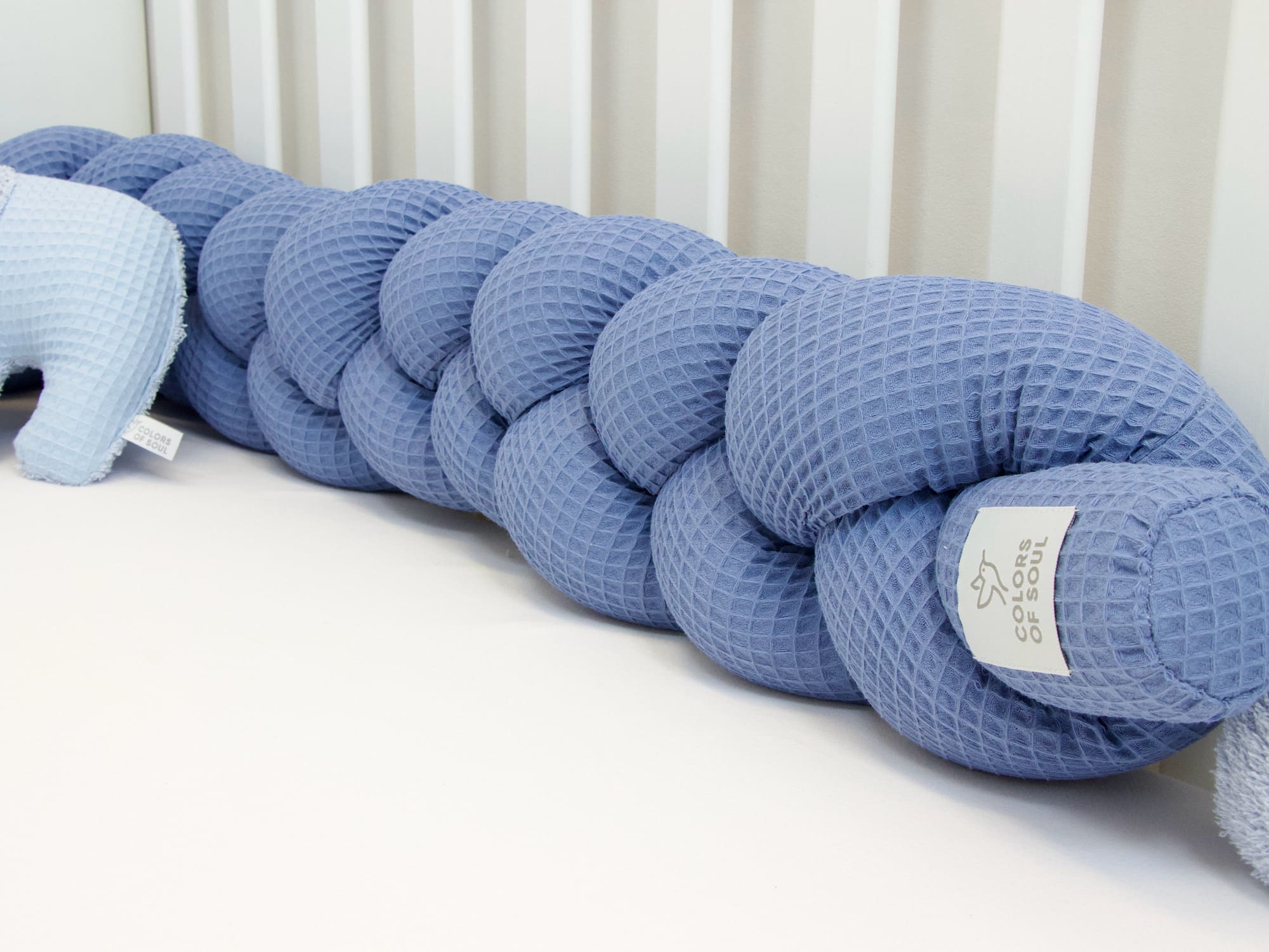 Geflochtene Bettschlange: Waffelpique blau